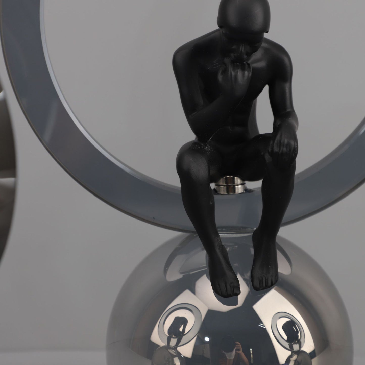 Black Man Sitting On Crystal Ball Table Showpiece