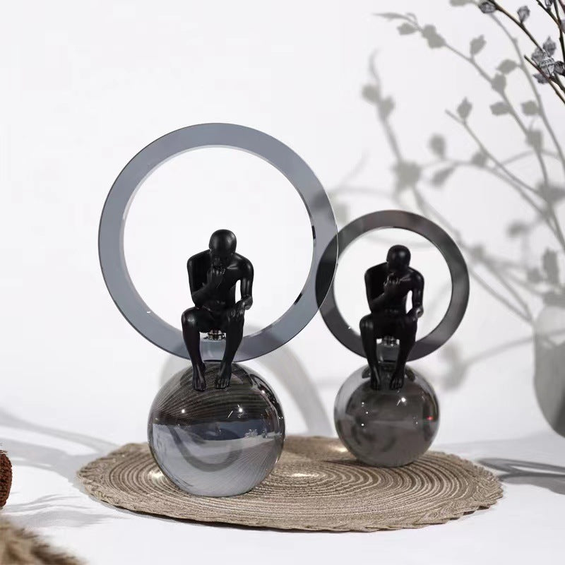 Black Man Sitting On Crystal Ball Table Showpiece